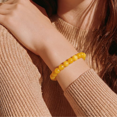 Butterscotch Baltic amber bead bracelet worn on the wrist