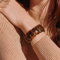 Green amber bracelet on wrist